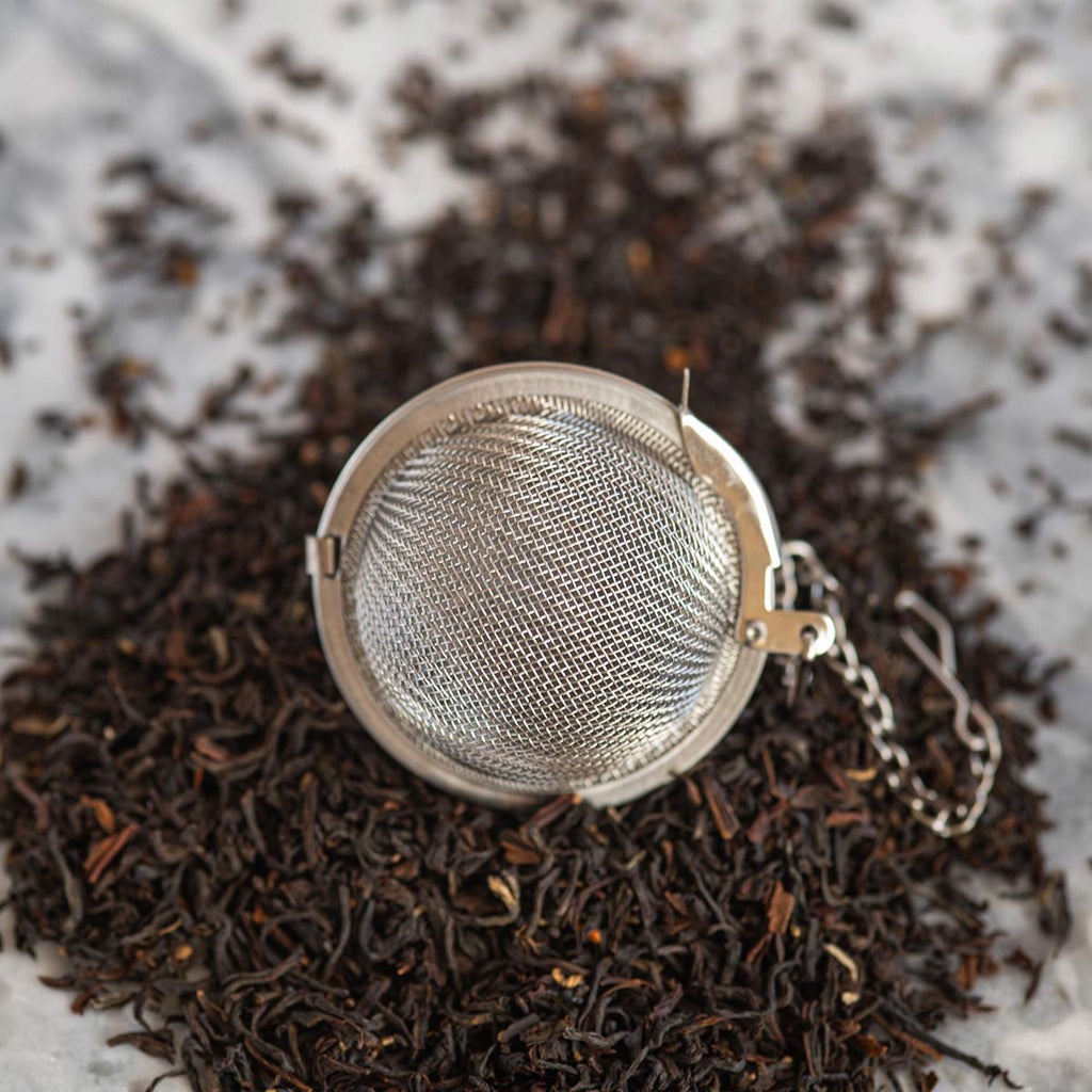 Stainless Steel Mesh Tea Strainer on a bed of tea leaves