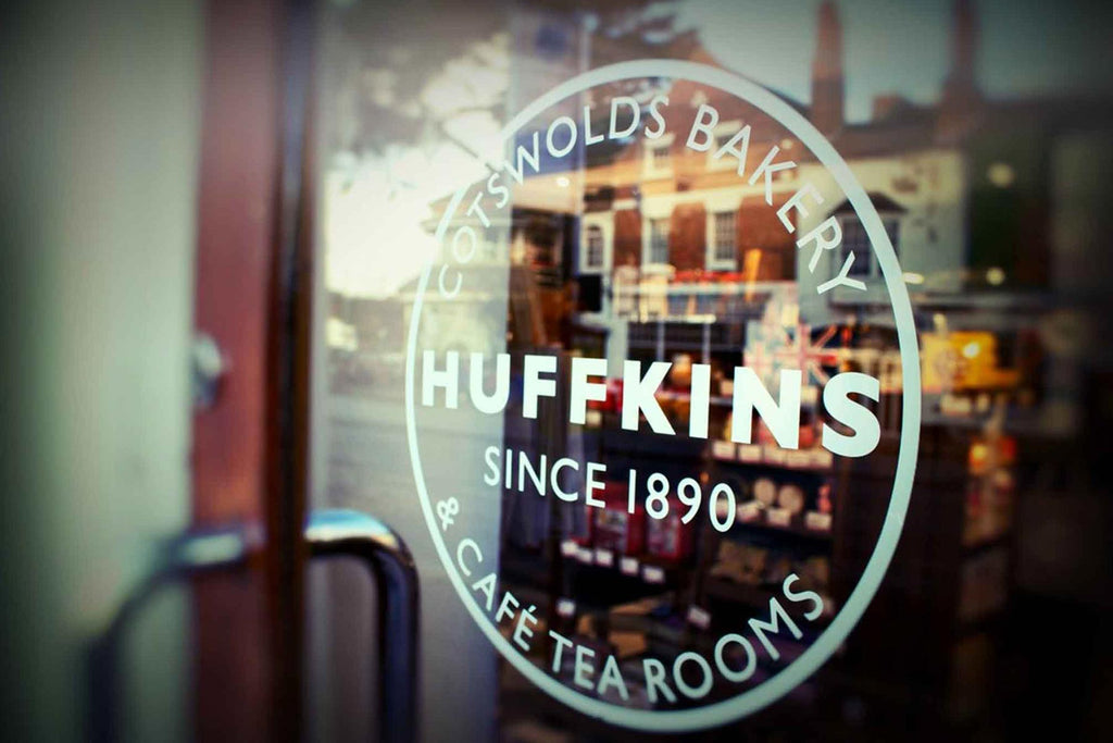 Huffkins logo on a glass door in Stratford tea room in the Cotswolds