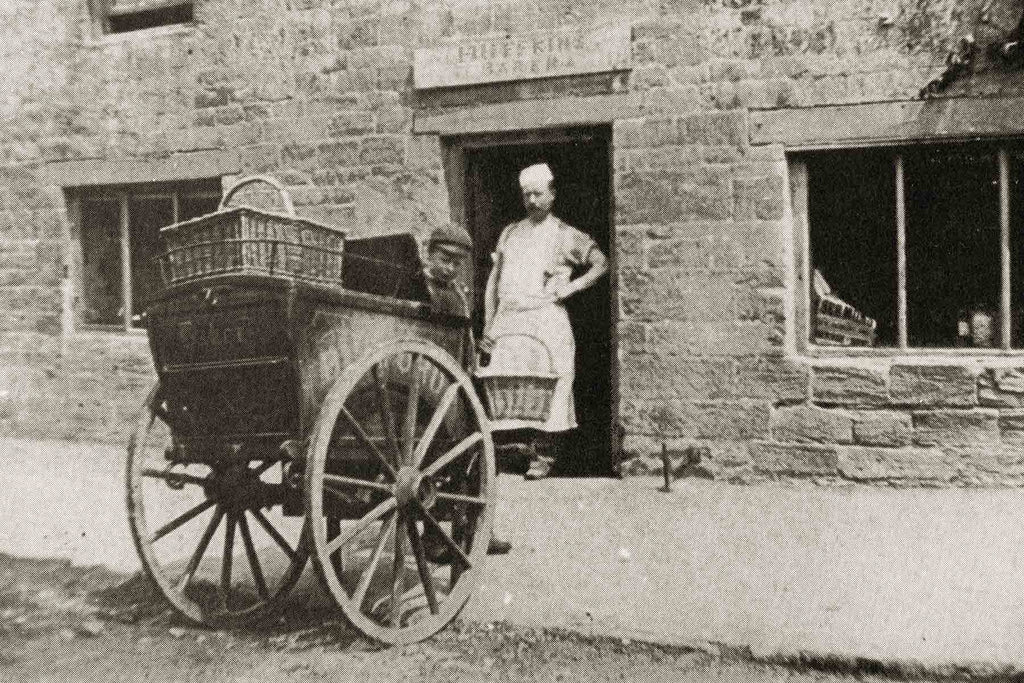 Mr Titcomb, founder of Huffkins bakery, outside a Cotswolds stone cottage c.1890